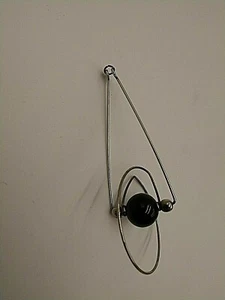ABSTRACT BLACK PLASTIC BEAD & SILVERTONE WIRES PENDANT CHARM ROTATES VINTAGE - Picture 1 of 7