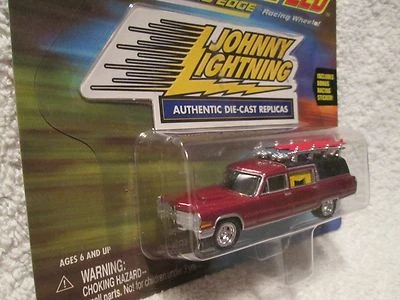 J L HAULIN HEARSE CADILLAC 97 JOHNNY LIGHTNING speed racers edge  1:64 maroon - Image 1 of 4