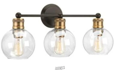 Lámpara de tocador de baño costera de vidrio transparente bronce antiguo de 3 luces de la colección Hansford Foto 1 de 2