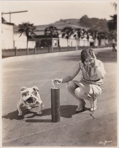 1928 Press Photo WAMPAS Star Actress Barbara Kent Lights Fireworks with "Bozo" - Picture 1 of 2