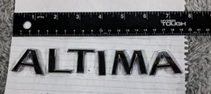 Genuine OEM Nissan 84895-JA000 Rear Trunk Lid Emblem 2007-2012 Altima label - Picture 1 of 5