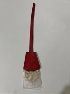 Ciondolo borsa portachiavi Tory Burch logo oro pelle saffiano clochette rosso - Foto 1 di 11