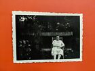 Vintage Photo a women sitting in easy chair at house yard  P005G