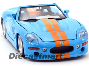 MAISTO 1:18 DIECAST SHELBY SERIE 1 RAYAS ORO AZUL - Imagen 1 de 9