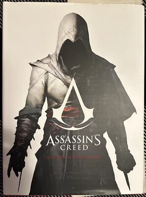 Chaqueta antipolvo Assassin’s Creed historia visual completa casi nueva Book Insight 2015 Foto 1 de 4