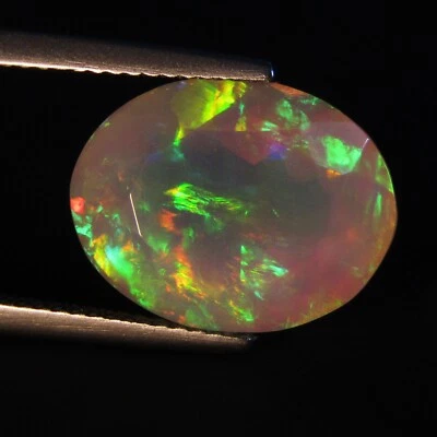 6.00Cts Natural Color Play White Opal 15x11.6x8mm Oval Faceted Loose Gemstone - Image 1 of 4