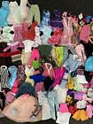 Huge lot of 11" Barbie Dolls and Doll clothes and accessories.