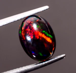 Opale etiope nero naturale forma ovale cabochon pietra preziosa sfusa 2,55 ct 11X8X5 mm - Foto 1 di 3