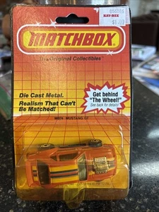 VINTAGE MATCHBOX-MB#74 MUSTANG GT 427 ORANGE Diecast 1:64 1983 NIP - Picture 1 of 2