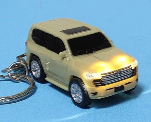 TOYOTA 300 Series Land Cruiser LED Headlight Pullback Car Mini Keychain - Picture 1 of 4