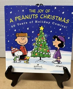 The Joy of a Peanuts Christmas 50 years of Holiday Comics, Schultz, Hallmark - Picture 1 of 4