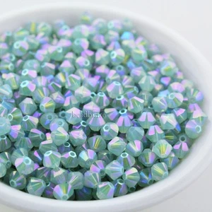 Swarovski Bicones, Pacific Opal Shimmer 2X, 3mm, 4mm Bicones #5328 XILION - Picture 1 of 3