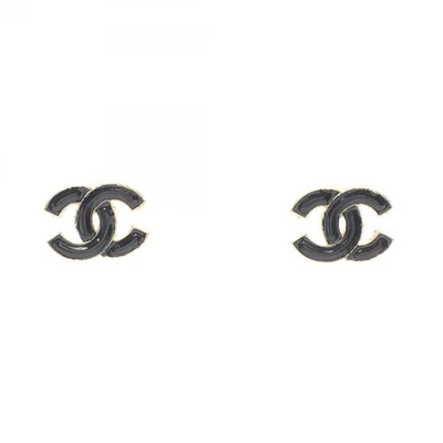 Pendientes perforados marca CHANEL COCO chapados en oro negro usados CC Foto 1 de 4