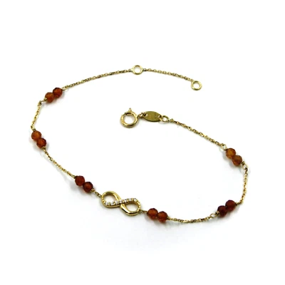 Pulsera oro amarillo 18k 7.5" con circonitas facetadas naranja 3mm, infinito central Foto 1 de 4