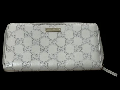 Cartera GUCCI Guccissima de cuero con cremallera alrededor blanca en relieve GG Continental | Certificado de autenticidad Foto 1 de 4