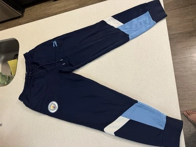 Pantalones deportivos Manchester City azul oscuro para hombre medianos PUMA mercancía oficial Foto 1 de 4