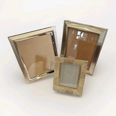 Lote de 3 marcos de fotos dorados y plateados con respaldo de terciopelo 2-8x10 1-5x7 Foto 1 de 4