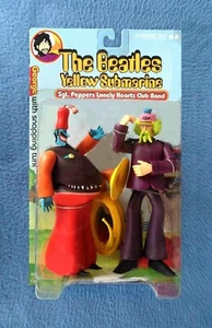 FIGURA MCFARLANE MCFARLANE DE LOS BEATLES GEORGE HARRISON CON AMARILLO TURCO - Imagen 1 de 2
