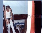 GAY INTEREST PHOTO R+3515 MAN POSED IN ROOM BY BED PUTTING PANTS ON