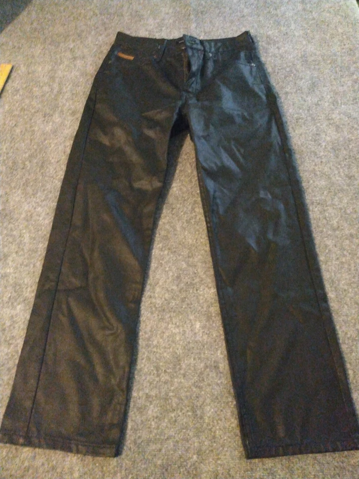 Pantalones de mezclilla negros brillantes de pierna ancha Sean John para niños talla 16 Foto 1 de 4
