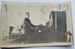C 1907 RPPC WOMAN PLAYING A PIANO OR ORGAN ADAPTED FOR BRAILLE ? - Picture 1 of 2