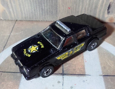 Hot Wheels Plymouth State Police 1986 Made in Hong Kong Flip Out Roarin' 1:64 - Immagine 1 di 4