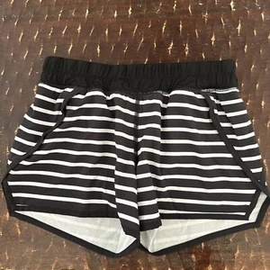 ivivva by Lululemon girls size 12. Black and white striped. Zipper side pockets. - Picture 1 of 5