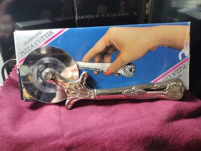 Cortador de pizza vintage plateado con hoja de acero inoxidable Foto 1 de 4