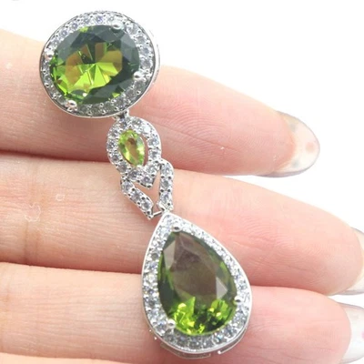 Compre 3 y obtenga 1 gratis nuevo diseño 6,6 g verde peridoto blanco circonita cúbica colgante de plata para mujer Foto 1 de 3