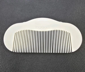Peine de pelo Clinique vintage dientes anchos plástico blanco desenredante 4,75 pulgadas peine monedero - Imagen 1 de 5