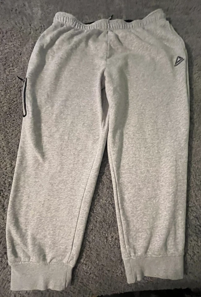 Pantalones de chándal Reebok para hombre 3XL grises con cremallera bolsillo puños cordón suaves Foto 1 de 4