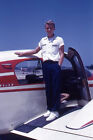 35mm Slide 1950s Red Border Kodachrome Young Man on Wing Propellor Plane Tarmac