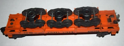 LIONEL LINES #636255, "ORANGE FLAT CAR with Three Wheels," (10" Long), Pre-Owned - Image 1 of 4