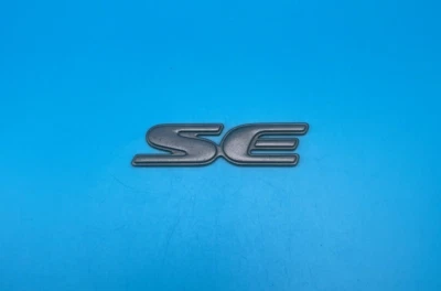 1997-2002 Pontiac Grand Prix SE Side Door Emblem Grey 2.625'' OEM 10246505 - Image 1 of 4