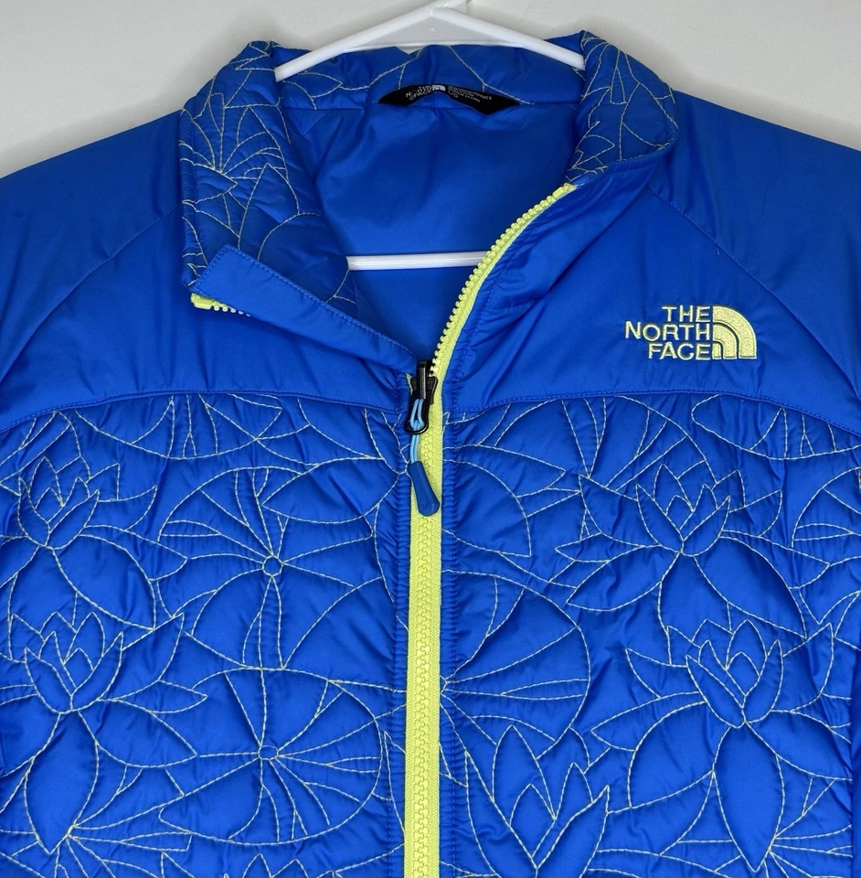 Chaqueta acolchada The North Face para mujer azul plumón grande L acolchada puntada amarilla Foto 1 de 4