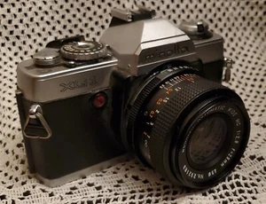 Cámara fotográfica Minolta XG-1 35 mm SLR con lente ROKINON AUTO ANCHO 1:28 LIMPIA sin probar - Imagen 1 de 9