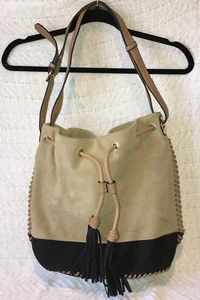Black Rivet Tan and Black Faux Suede Cinch Snap Close Bucket Bag with Tassels - Picture 1 of 16