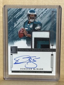 2025 Panini Impeccable #ERA-DMB Donovan McNabb Elegance Retired Patch Auto 01/75 - Bild 1 von 2