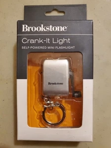 Brookstone Crank It Self Powered Mini Flashlight Silver With Keychain New - Foto 1 di 5