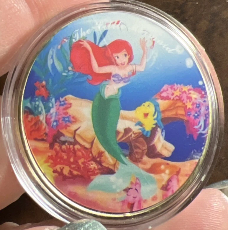 Moneda conmemorativa chapada en oro de Estados Unidos La Sirenita Foto 1 de 3