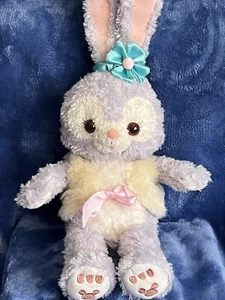 Disney Aulani Hawaii Stella Lou Peluche Conejito Flor Púrpura Arco 21” - Imagen 1 de 8
