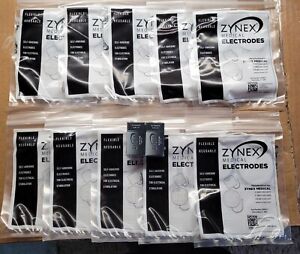 10-Pack of 4 ZYNEX MEDICAL Electrodes 2" Round TENS Pads #300027, plus 2 9-volts