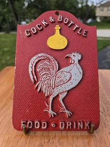 Targa insegna metallo gallo bevande cibo gallo cozzo e bottiglia vintage made in USA - Foto 1 di 8