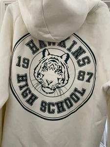 Stranger Things Hawkins Tigers �� Creme XL Hoodie - Bild 1 von 3