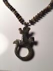 A fabulous soapstone necklace with a carved lizzard pendant. Mint Condition.