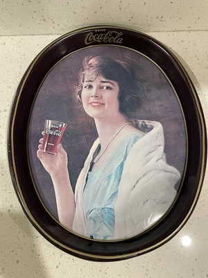1983 oval Coca-Cola metal serving tray LADY IN BLUE DRESS reproduction - Image 1 of 3