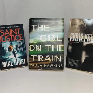 3 Novels "Saint Justice" "Blond Hair Blue Eyes"and"The Girl on the Train" - Bild 1 von 7