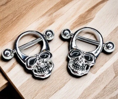 Par de anillos para pezones 14 g plata esqueleto calavera esmalte negro J155 Foto 1 de 3
