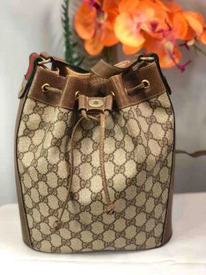 Bolso Cubo Vintage GUCCI GG Monograma Marrón Beige Cordón Foto 1 de 4