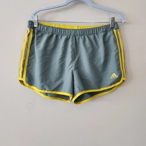 Pantalones Cortos Atléticos Adidas Para Mujer en Gris con Borde Amarillo Pista Correr Medianos - Imagen 1 de 5